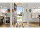 Bright foyer with tile flooring, arched windows, and a view of the front yard at 10240 Kabana Blvd, Clermont, FL 34711
