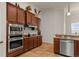 Well-equipped kitchen with stainless steel appliances and wood cabinets at 10240 Kabana Blvd, Clermont, FL 34711