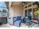 Covered patio with comfortable seating and access to both indoors and the hot tub at 10240 Kabana Blvd, Clermont, FL 34711