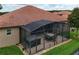 Enjoy this screened in lanai with a spa and outdoor dining area, perfect for relaxation and entertaining at 10240 Kabana Blvd, Clermont, FL 34711