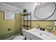 Bathroom featuring a white vanity, round mirror, shower, and yellow and white accents at 10303 Se Sunset Harbor Rd, Summerfield, FL 34491
