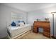 Bedroom featuring a daybed, desk, and light-filled window at 10303 Se Sunset Harbor Rd, Summerfield, FL 34491