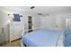 Bedroom with a white dresser and a view of a brick fireplace in the background at 10303 Se Sunset Harbor Rd, Summerfield, FL 34491