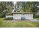 This lovely outbuilding offers a bench, double doors, hardiplank siding and space for storage at 10303 Se Sunset Harbor Rd, Summerfield, FL 34491