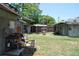 View of backyard, shed, and the exterior of home with workspace at 1095 Golden Isle Dr, Mount Dora, FL 32757