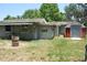 Backyard featuring lawn, shed, and side of house at 1095 Golden Isle Dr, Mount Dora, FL 32757