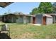 View of backyard, shed, and the exterior of home at 1095 Golden Isle Dr, Mount Dora, FL 32757