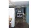 Unfinished basement laundry room with washer, dryer, and refrigerator at 1095 Golden Isle Dr, Mount Dora, FL 32757