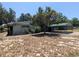 Exterior view of the property showing a carport, some greenery, and the side of the house at 1095 Golden Isle Dr, Mount Dora, FL 32757