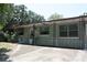 Exterior view of home featuring a covered porch, concrete driveway, and mature trees at 1095 Golden Isle Dr, Mount Dora, FL 32757