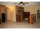 View of Living Room featuring tile floors, wood paneling and ceiling fan at 1095 Golden Isle Dr, Mount Dora, FL 32757