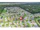 Aerial view of a residential neighborhood showcasing well-maintained homes and landscaping at 11019 Se 170Th Lane Rd, Summerfield, FL 34491