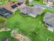 Aerial view of home with screened-in lanai, and lush, green backyard at 11019 Se 170Th Lane Rd, Summerfield, FL 34491