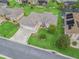 Aerial view of a home's manicured lawn, landscaped yard, and a long driveway at 11019 Se 170Th Lane Rd, Summerfield, FL 34491