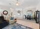 The open-concept living room leads to the dining area, featuring neutral colors and tile floors at 11019 Se 170Th Lane Rd, Summerfield, FL 34491