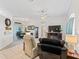 Spacious living room with tile flooring and lots of natural light at 11019 Se 170Th Lane Rd, Summerfield, FL 34491