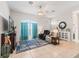 Inviting living room with tile floors, ceiling fan, and lots of natural light at 11019 Se 170Th Lane Rd, Summerfield, FL 34491
