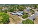 Aerial view of neighborhood, showcasing the home, landscaping, and nearby lake at 1119 Pine Ave, Tavares, FL 32778
