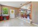 Welcoming entryway featuring tile floors, vintage desk, and view into the dining area at 1119 Pine Ave, Tavares, FL 32778