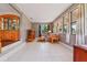 Bright living room with tile floors, large windows, and comfortable seating area at 1119 Pine Ave, Tavares, FL 32778