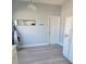 The dining room features neutral walls, vinyl flooring, and a convenient door to the kitchen at 112 Arlington Ct, Haines City, FL 33844