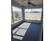 Relaxing screened-in porch with neutral flooring and views of the fenced backyard at 112 Arlington Ct, Haines City, FL 33844