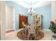 Elegant dining room features a chandelier, decorative cabinet, and carpet at 11215 Se 172Nd Place, Summerfield, FL 34491