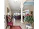 Inviting foyer with elegant decor, neutral tones, and an open view into the spacious living room at 11215 Se 172Nd Place, Summerfield, FL 34491