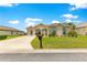 Attractive home featuring manicured landscaping, a well-kept lawn, and a welcoming facade at 11215 Se 172Nd Place, Summerfield, FL 34491