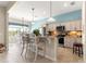 Well-equipped kitchen featuring an island with bar stools, modern appliances, and an open design at 11215 Se 172Nd Place, Summerfield, FL 34491