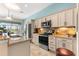 Modern kitchen showcasing granite countertops, stainless steel appliances, and ample cabinet space at 11215 Se 172Nd Place, Summerfield, FL 34491