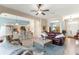 Comfortable living room with open layout into the adjacent kitchen, lots of windows and lots of natural light at 11215 Se 172Nd Place, Summerfield, FL 34491