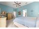 Spacious main bedroom features a ceiling fan, light blue walls and plush carpet at 11215 Se 172Nd Place, Summerfield, FL 34491