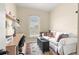 Comfortable office space with natural light, a work desk, and sofa with decorative pillows at 11215 Se 172Nd Place, Summerfield, FL 34491