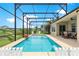 Inviting pool with clear blue water, surrounded by a spacious deck and patio furniture at 11215 Se 172Nd Place, Summerfield, FL 34491