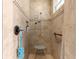 Walk-in shower features tile, shower head, handheld wand, and a seat at 11215 Se 172Nd Place, Summerfield, FL 34491