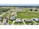 A panoramic drone shot displays several residences, all surrounded by undeveloped land at 1127 Fiesta Key Cir, Lady Lake, FL 32159