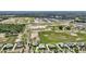 Expansive aerial view of planned community in a country setting surrounded by trees and green space at 1127 Fiesta Key Cir, Lady Lake, FL 32159