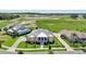 A beautiful aerial view of a landscaped single Gathering residence with a large manicured lawn at 1127 Fiesta Key Cir, Lady Lake, FL 32159