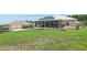 Well manicured lawn, and covered porch at 1127 Fiesta Key Cir, Lady Lake, FL 32159