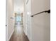 Hallway view of stunning glass enclosed shower with chandeliers in the bathroom at 1127 Fiesta Key Cir, Lady Lake, FL 32159