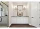Bathroom boasting dual vanity, granite countertop, and glass enclosed shower at 1127 Fiesta Key Cir, Lady Lake, FL 32159