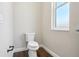 Clean, well-lit bathroom with modern fixtures, a white toilet, and a window to let in natural light at 1127 Fiesta Key Cir, Lady Lake, FL 32159