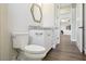 Elegant bathroom featuring vanity with granite countertop, modern fixtures, and view to other rooms at 1127 Fiesta Key Cir, Lady Lake, FL 32159