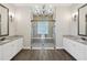 Bathroom boasts double vanity, and a large glass enclosed shower with seat at 1127 Fiesta Key Cir, Lady Lake, FL 32159