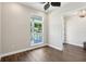 Bedroom boasts hardwood floors, ample natural light, and neutral paint at 1127 Fiesta Key Cir, Lady Lake, FL 32159