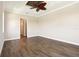 Bedroom with tray ceilings, wood flooring, and an ample amount of wall space at 1127 Fiesta Key Cir, Lady Lake, FL 32159