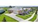 A well manicured home, including the lawn, has a driveway leading to a two car garage at 1127 Fiesta Key Cir, Lady Lake, FL 32159
