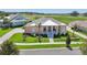 Inviting single-Gathering home with a manicured lawn, covered entry, and beautifully landscaped grounds at 1127 Fiesta Key Cir, Lady Lake, FL 32159