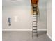Spacious garage with epoxy floors and access to attic via pull down stairs at 1127 Fiesta Key Cir, Lady Lake, FL 32159